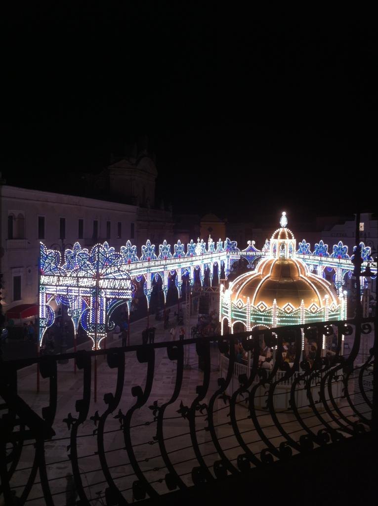 The luminarie of the festa seen from a balcony at night, Manduria, Salento, Puglia